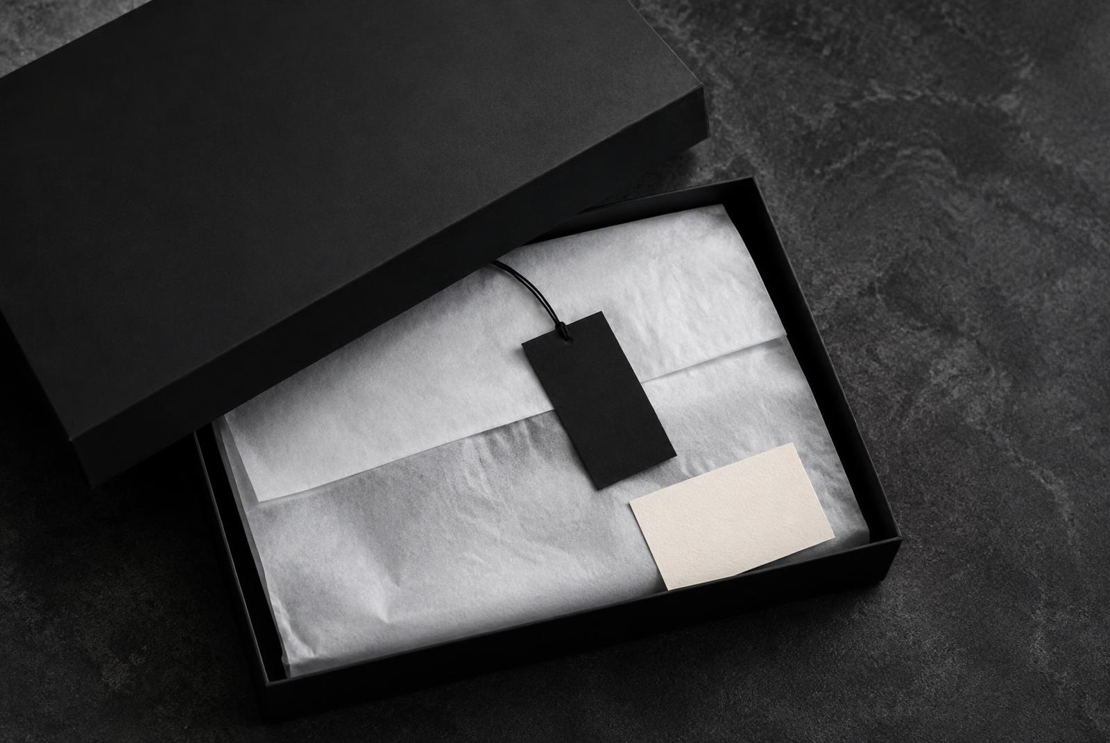 Matte black garment box with tissue and swing tag